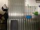 Organized storage solutions in garage with corrugated panels for efficient use of space and storage at 1488 Squaw Ln, North Port, FL 34286