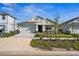 Charming single-story home featuring a well-manicured lawn and inviting front porch at 16029 Mulrion Blvd, Punta Gorda, FL 33982