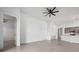 Open layout combines living spaces, enhanced by neutral walls and modern tile flooring at 16029 Mulrion Blvd, Punta Gorda, FL 33982