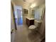 This bathroom has a wood vanity with large mirror, medicine cabinet and ceramic tile floors at 19583 Kapok Ct, Port Charlotte, FL 33952