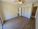 This bedroom has wood-look flooring and a closet with bi-fold doors at 19583 Kapok Ct, Port Charlotte, FL 33952