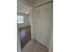 This hallway leads to a bedroom and a closet with bi-fold doors at 19583 Kapok Ct, Port Charlotte, FL 33952