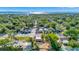 An aerial view of a charming neighborhood near the Bay shows this coral-colored home with tile roof accents at 2002 Central Ave, Sarasota, FL 34234