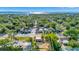An aerial view showcases this property's prime location surrounded by lush greenery near the waterfront at 2002 Central Ave, Sarasota, FL 34234