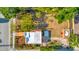 An aerial top-down view shows the paver patio, detached garage, and lush landscaping of this home at 2002 Central Ave, Sarasota, FL 34234