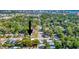 An aerial view shows this home is surrounded by lush landscaping in a desirable neighborhood at 2002 Central Ave, Sarasota, FL 34234