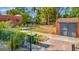 A spacious backyard featuring a detached garage and brick paver patio, ready for fun in the sun at 2002 Central Ave, Sarasota, FL 34234