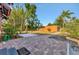 A brick paver patio and a cement pad are ready for entertaining or relaxing in this backyard oasis at 2002 Central Ave, Sarasota, FL 34234