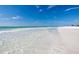 Beautiful shoreline with crystal-clear water and pristine white sand, perfect for relaxation at 2002 Central Ave, Sarasota, FL 34234