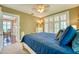Bright bedroom with three windows, a cozy bed, and access to additional rooms at 2002 Central Ave, Sarasota, FL 34234