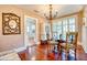 Bright dining room with hardwood floors, chandelier, and window shutters at 2002 Central Ave, Sarasota, FL 34234