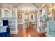 Open dining room with hardwood floors, chandelier, and seamless archways at 2002 Central Ave, Sarasota, FL 34234