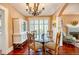 Open concept dining room with chandelier and access to the living room at 2002 Central Ave, Sarasota, FL 34234