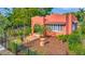 Charming home featuring a well-manicured front yard, mature trees, and a welcoming entrance at 2002 Central Ave, Sarasota, FL 34234