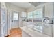Bright kitchen featuring white cabinets, modern appliances, and ample counter space at 2002 Central Ave, Sarasota, FL 34234