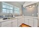 Cozy kitchen featuring white cabinets, modern appliances, and tile backsplash at 2002 Central Ave, Sarasota, FL 34234