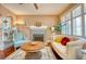 Inviting living room featuring a decorative fireplace and plantation shutters at 2002 Central Ave, Sarasota, FL 34234