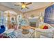 Spacious living room with hardwood floors, a fireplace, and arched entryway into the dining area at 2002 Central Ave, Sarasota, FL 34234