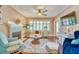 Cozy living room featuring hardwood floors, a fireplace, and natural light from large windows at 2002 Central Ave, Sarasota, FL 34234