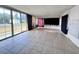 Bright sunroom with tile floors and sliding glass doors leading to the backyard at 22392 Buffalo Av, Port Charlotte, FL 33952