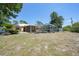 Expansive backyard featuring a screened pool area, perfect for enjoying the outdoors and entertaining at 22435 Fortune Ave, Port Charlotte, FL 33954