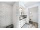 Nicely tiled bathroom featuring a shower and vanity with ample storage at 22435 Fortune Ave, Port Charlotte, FL 33954