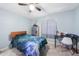 Bedroom with tile floors, ceiling fan and a large window at 22435 Fortune Ave, Port Charlotte, FL 33954
