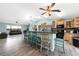 Spacious kitchen with breakfast bar, light wood cabinetry, and open to the living room for easy interaction at 22435 Fortune Ave, Port Charlotte, FL 33954