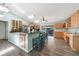 Well-lit kitchen featuring light wood cabinets, a breakfast bar, and an open layout perfect for cooking and entertaining at 22435 Fortune Ave, Port Charlotte, FL 33954