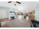 Open floor plan seamlessly connects the living room to the kitchen, great for both relaxing and entertaining guests at 22435 Fortune Ave, Port Charlotte, FL 33954