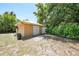 Exterior view of a storage shed with a white door, providing extra storage space at 22435 Fortune Ave, Port Charlotte, FL 33954
