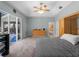 Bedroom with carpeted floors, a ceiling fan, and a slider to the outdoor covered patio at 2288 Prague Ln, Punta Gorda, FL 33983