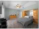 Bedroom featuring carpeted floors, a ceiling fan, and an en suite bathroom at 2288 Prague Ln, Punta Gorda, FL 33983