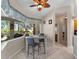 Bright dining area boasts a glass-top table with views of the backyard at 2288 Prague Ln, Punta Gorda, FL 33983