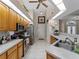 Bright kitchen featuring wood cabinets, stainless steel appliances, and a neutral countertop at 2288 Prague Ln, Punta Gorda, FL 33983
