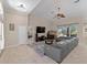 Bright living room boasts an open layout, tile flooring, and access to the outdoors at 2288 Prague Ln, Punta Gorda, FL 33983