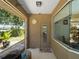Enclosed patio with outdoor seating, potted plants, and a view of the backyard at 2288 Prague Ln, Punta Gorda, FL 33983