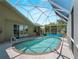 Enjoy this screened-in pool with a lounging area, steps and easy access to the home at 2288 Prague Ln, Punta Gorda, FL 33983