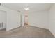 Bedroom featuring neutral carpet and an ensuite bathroom at 23470 Burlingame Ave, Punta Gorda, FL 33980