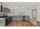 Modern kitchen boasting stainless steel appliances, gray cabinets and a practical layout at 23470 Burlingame Ave, Punta Gorda, FL 33980