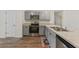 Stylish kitchen showcasing stainless steel appliances, gray cabinets, and modern finishes at 23470 Burlingame Ave, Punta Gorda, FL 33980