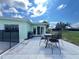 Outdoor patio with seating and grill, perfect for enjoying the Florida weather at 2500 Aquilos Ct, Port Charlotte, FL 33952