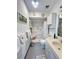 Bright bathroom with a shower, vanity and a built in toiletry cabinet at 2500 Aquilos Ct, Port Charlotte, FL 33952