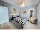 Inviting bedroom with blue accents, and direct closet access at 2500 Aquilos Ct, Port Charlotte, FL 33952