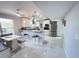 Open kitchen design with granite countertops, stainless steel appliances, breakfast bar, and modern lighting at 2500 Aquilos Ct, Port Charlotte, FL 33952