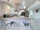 Modern kitchen with stainless steel appliances, granite countertops, breakfast bar, and barstool seating at 2500 Aquilos Ct, Port Charlotte, FL 33952