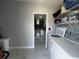 Practical laundry room with modern appliances and convenient access to the kitchen at 2500 Aquilos Ct, Port Charlotte, FL 33952