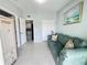 Inviting living room featuring neutral walls and a comfortable green sofa at 2500 Aquilos Ct, Port Charlotte, FL 33952