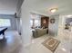 Cozy living room with open access to the game room and access to the bedrooms at 2500 Aquilos Ct, Port Charlotte, FL 33952
