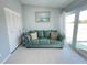 Comfortable living room with plush seating, sliding glass doors and a coastal view at 2500 Aquilos Ct, Port Charlotte, FL 33952